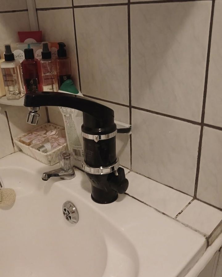 Elegance Tap at a bathroom basin