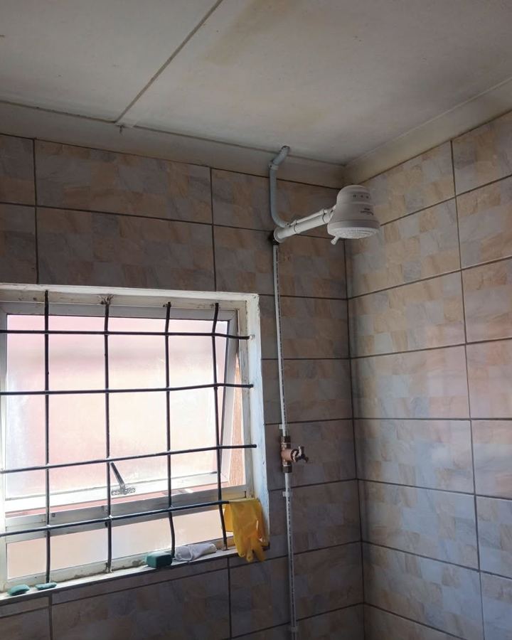 White instant shower installed